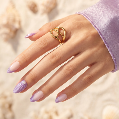 Lilac shimmer French tip press-on nails with pearl accent and shell-shaped design