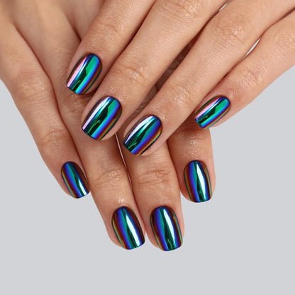 Short square soft gel press-on nails in oil-slick chrome with iridescent blue, green and purple finish