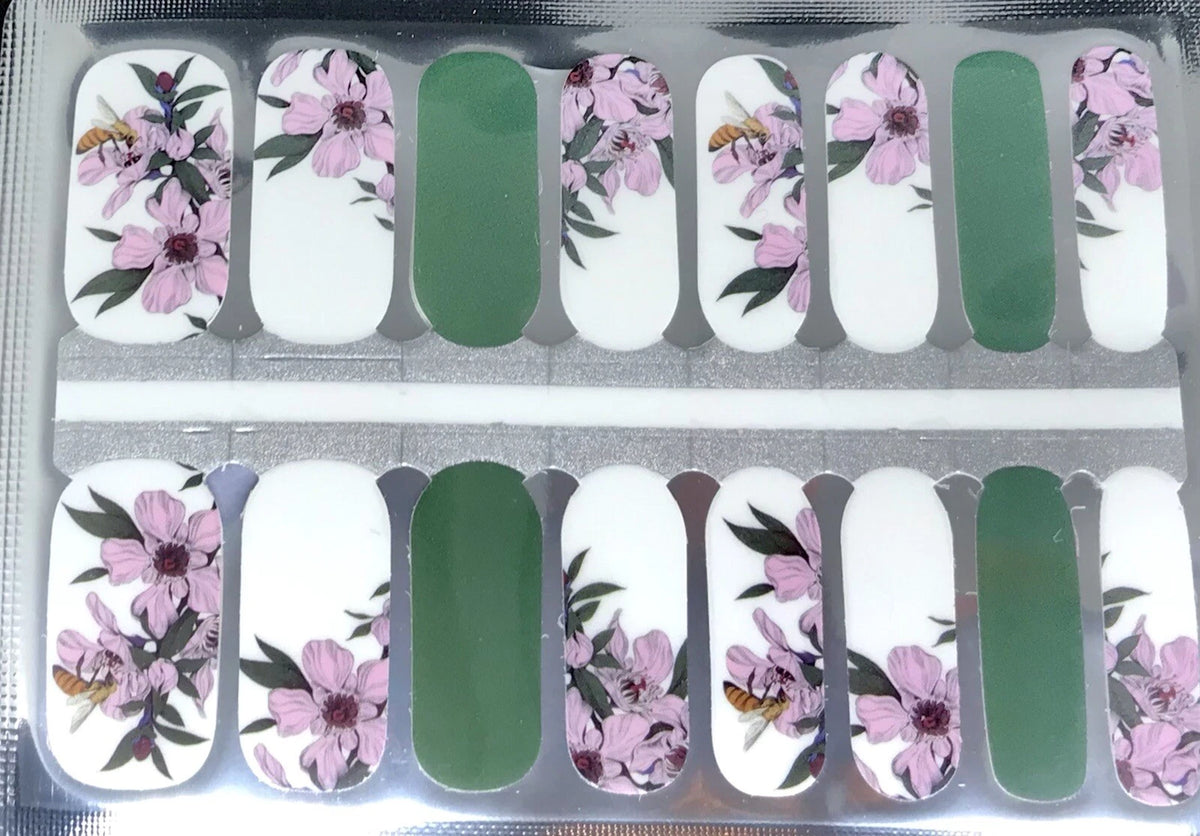 Nail wraps, white with pink floral bee print and solid green accent nails